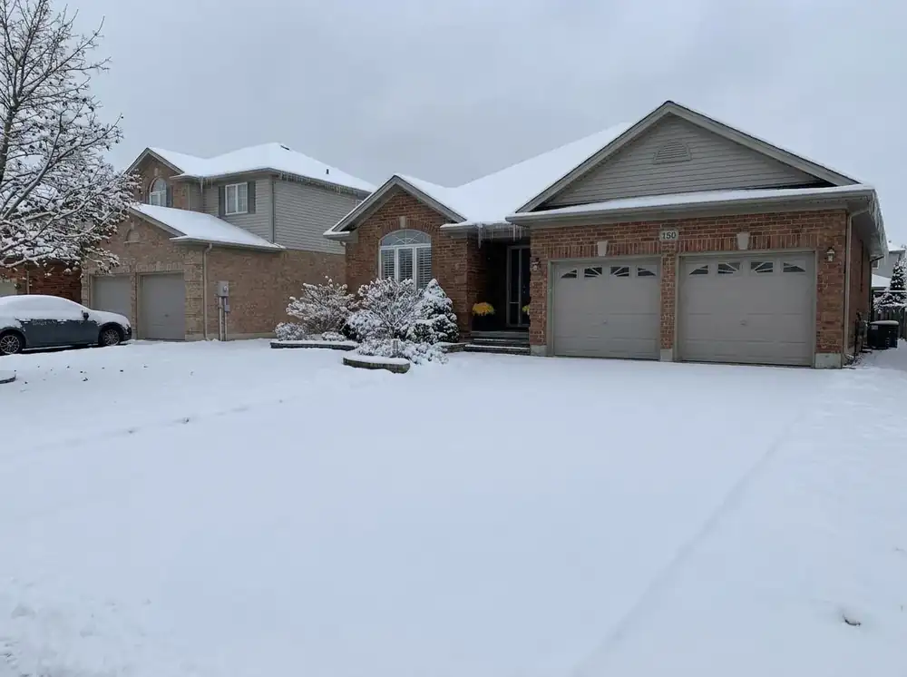House and yard under fresh snow