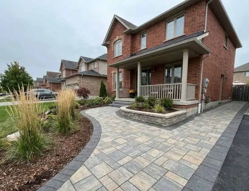 Curved interlock walkway with planting bed after hardscaping