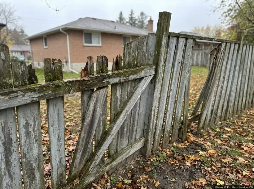 Old weathered fence in London, Ontario before replacement