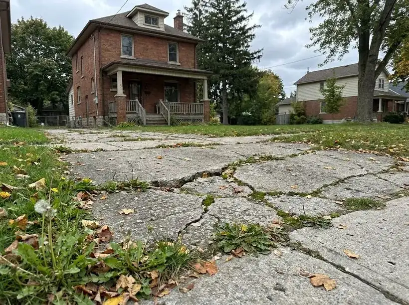 Cracked old concrete driveway before hardscaping