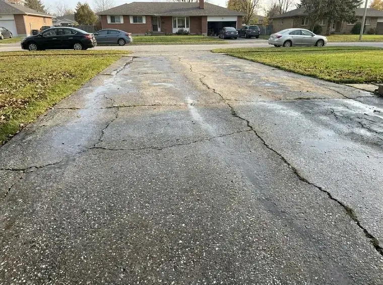 Clean concrete driveway after pressure washing